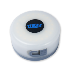 Bird's-eye view of the lamp with retracted cable, black Tyrolit logo centered on top